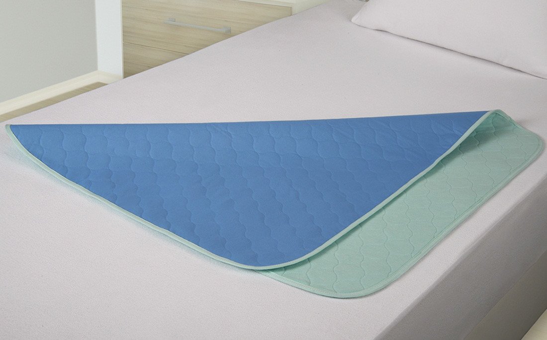 ABSO underpad placed on a care bed