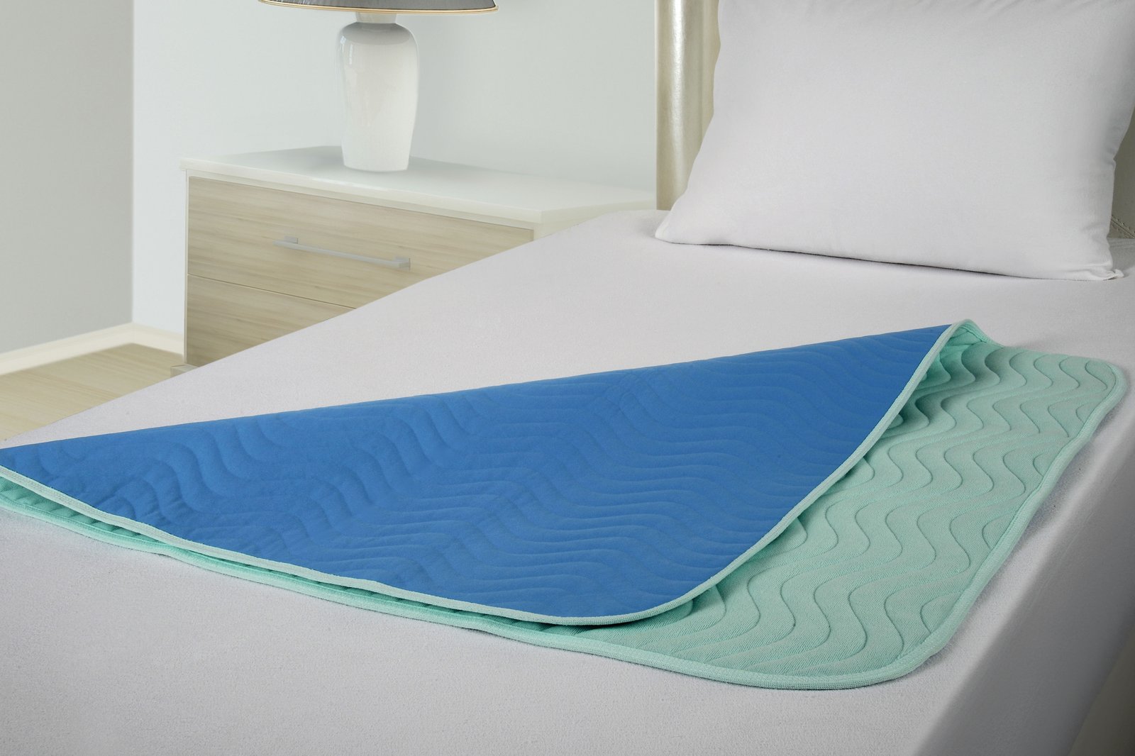 ABSO underpad on a bed